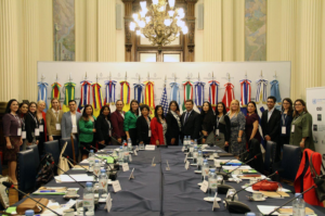 3rd MPLLAC 1 Group photo of the participants at the meeting table, with flags in the background