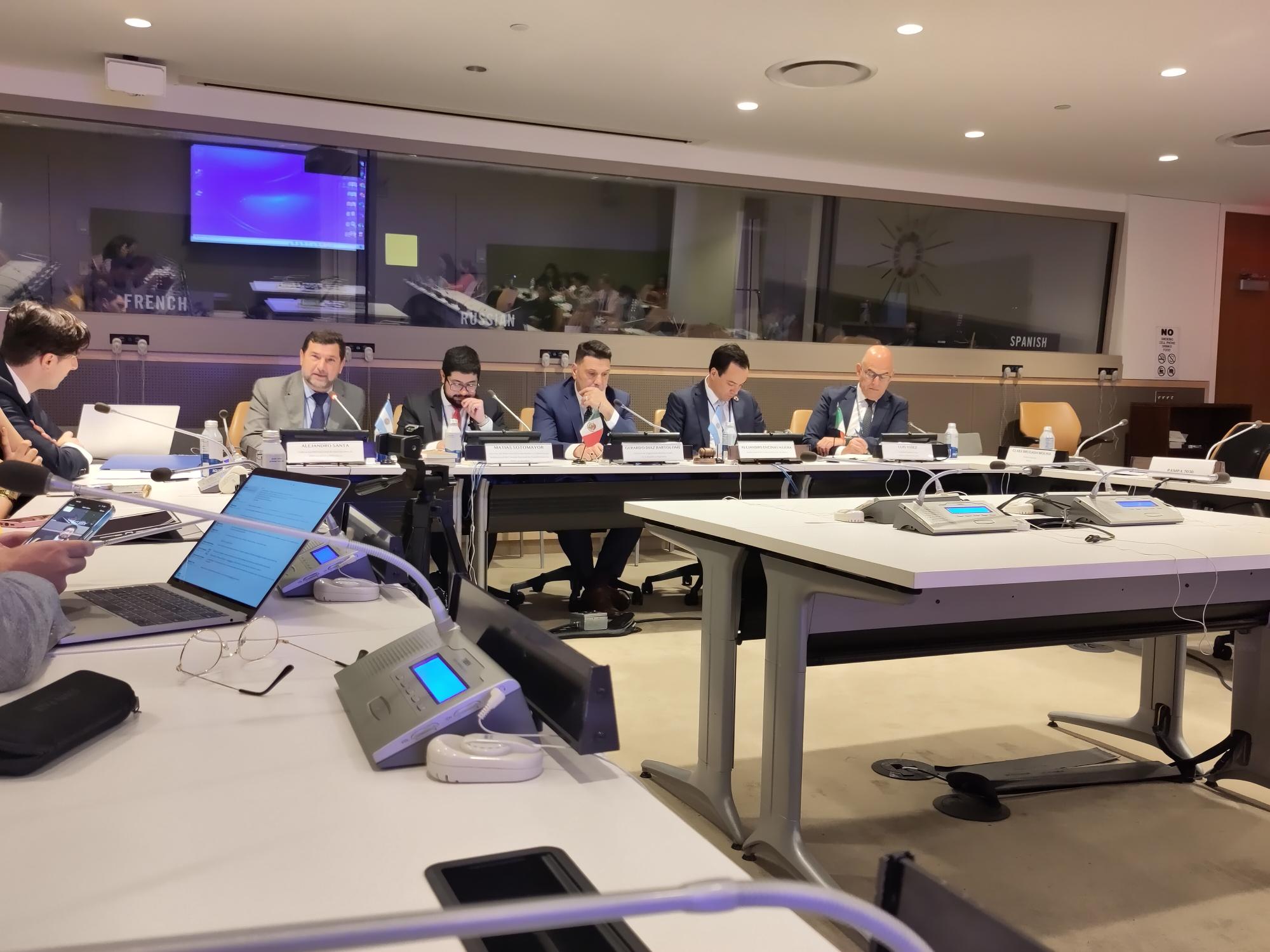 Alejandro event Panel of speakers in a conference room