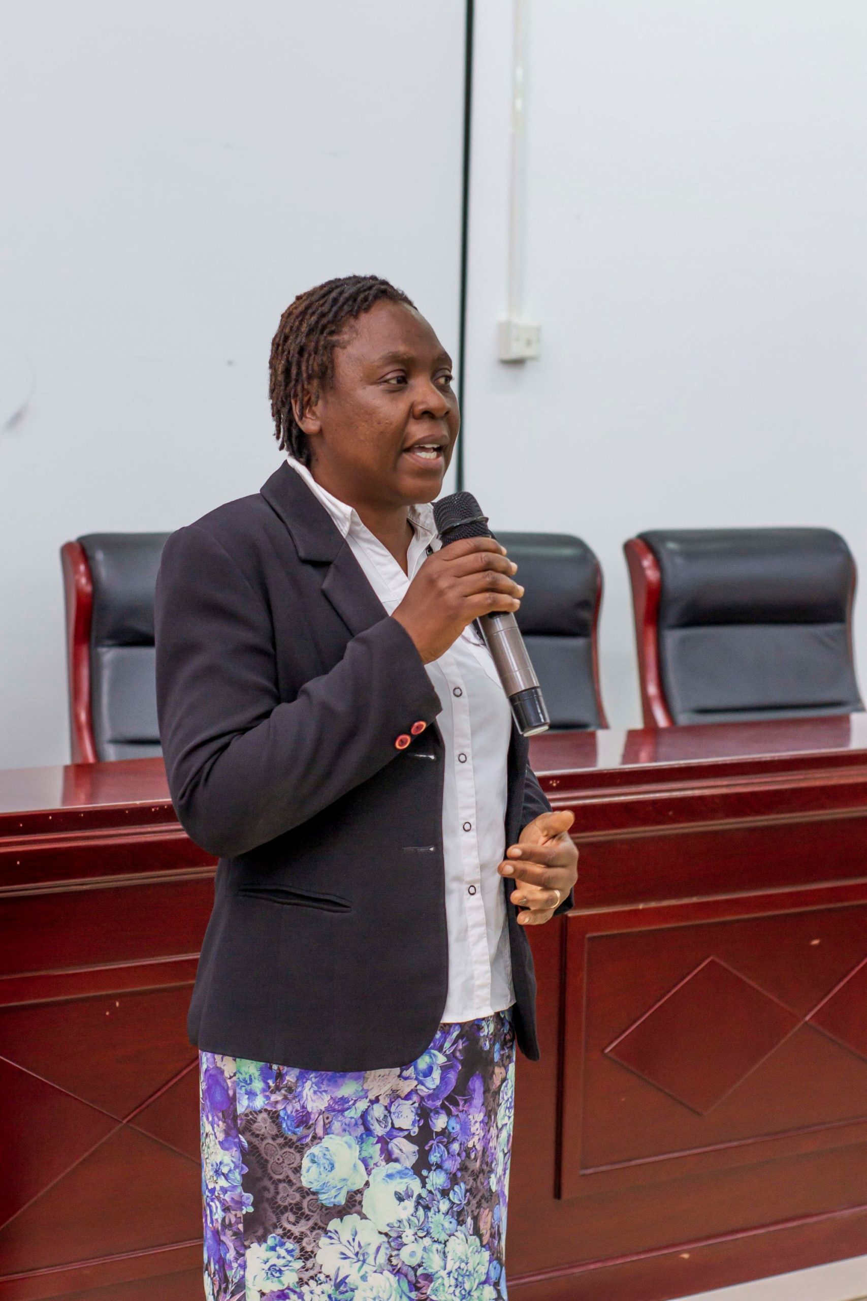 Mutinta giving her closing remarks scaled Picture of a woman speaking with a microphone