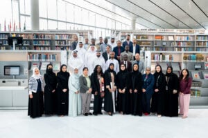 An image of a group of people posing for a group image at a library