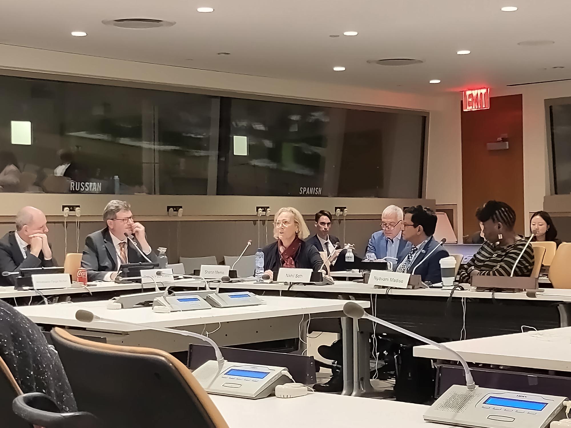 Sharon event Panel of speakers in a conference room