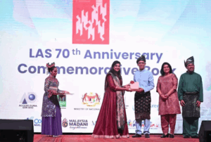 The President of the Librarian Association of Singapore Shameem Nilofar presenting their publication to CONSAL XIX The President of the Librarian Association of Singapore Shameem Nilofar presenting their publication to CONSAL XIX