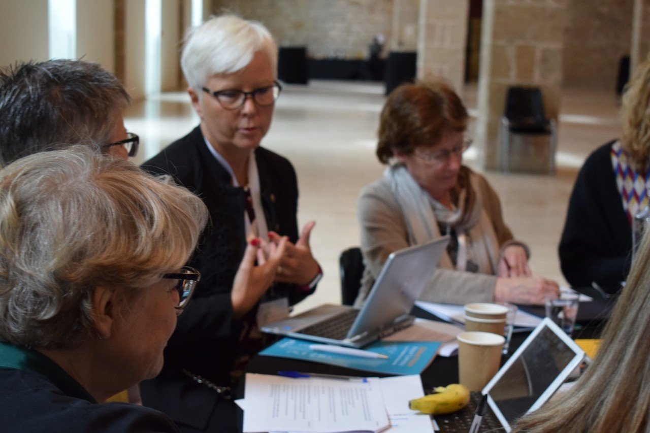 Global Vision participant discusses with her group