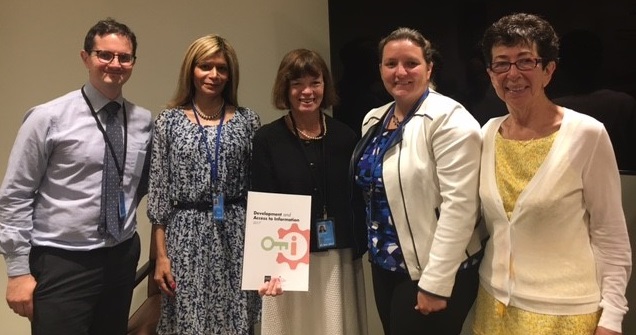 IFLA President, Donna Scheeder, holding the DA2I report with (from left to right): IFLA Manager of Policy and Advocacy, Stephen Wyber, IFLA Governing Board Member, Loida Garcia Febo, Quinn McKew, Article 19 Deputy Executive Director, and Nancy Hafkin, Women in Global Science and Technology
